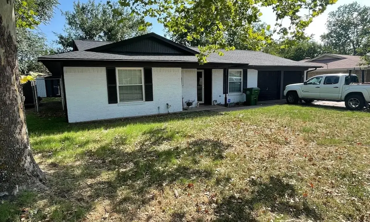 Professional roofing crew working on a residential roof in Ocean Shores